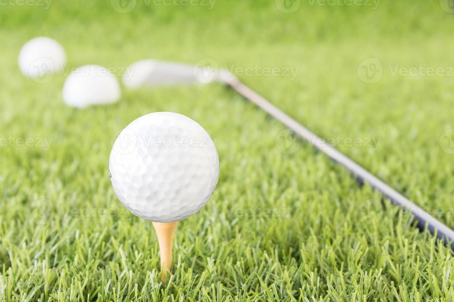 Golf ball on tee photo