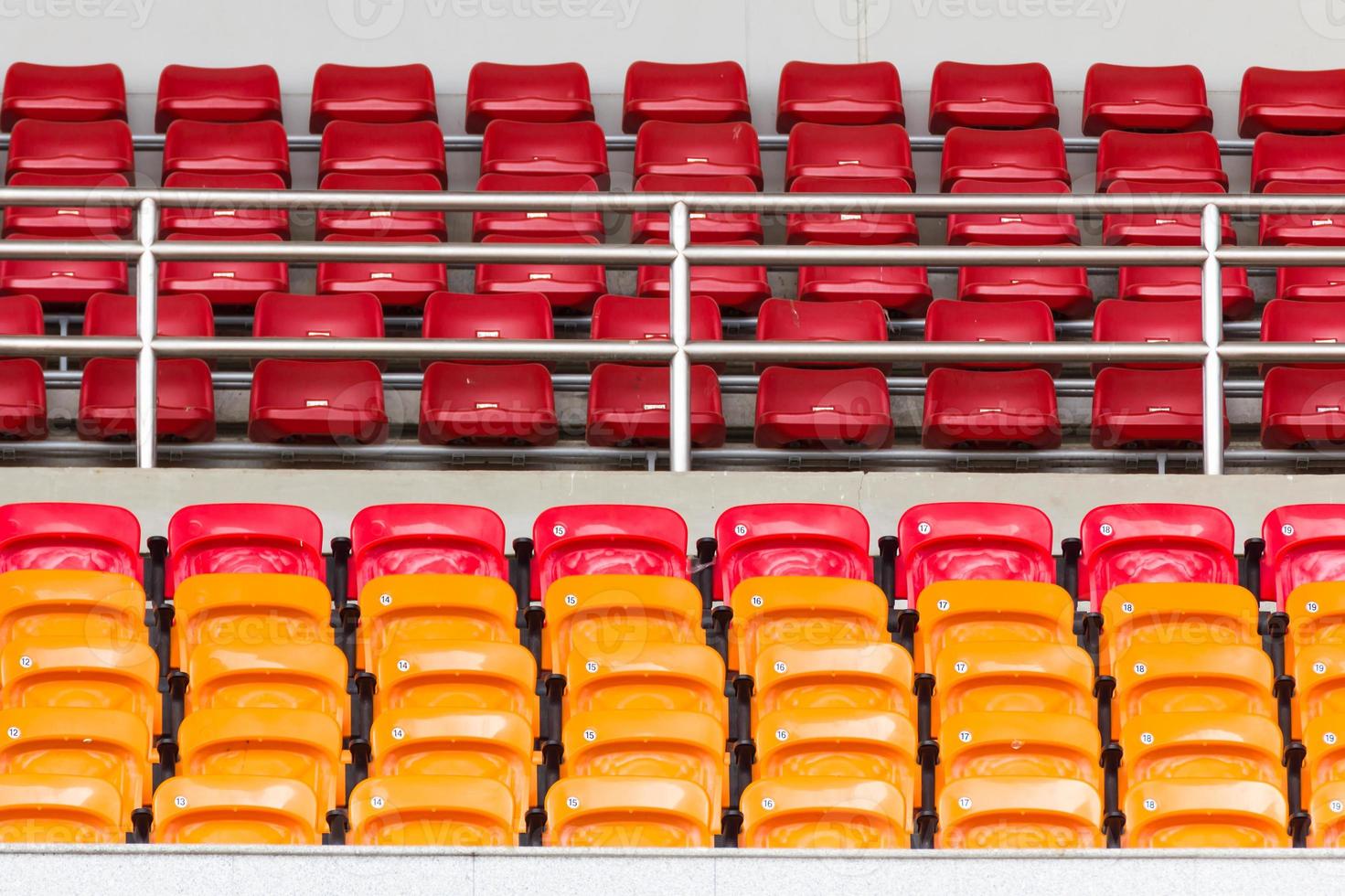 Rows of empty plastic stadium seats photo
