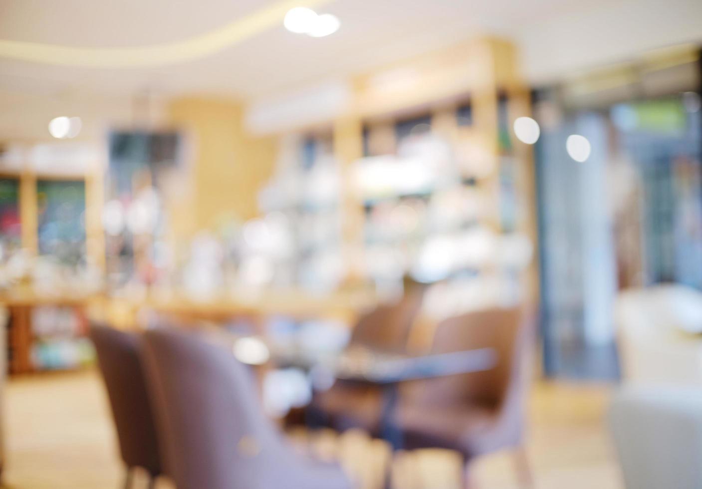 Blurred background interior of cafe or restaurant with light and bokeh photo