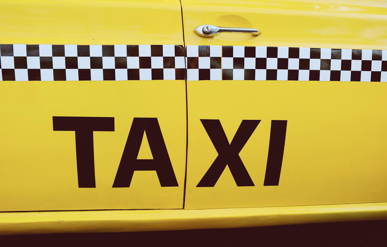 The side of New York City yellow taxi cab photo