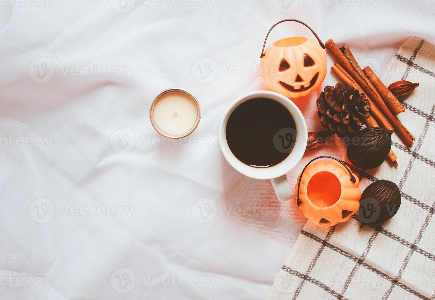 Flat lay of autumn and thanksgiving arrangement style with halloween pumpkin on white sheet blanket background photo