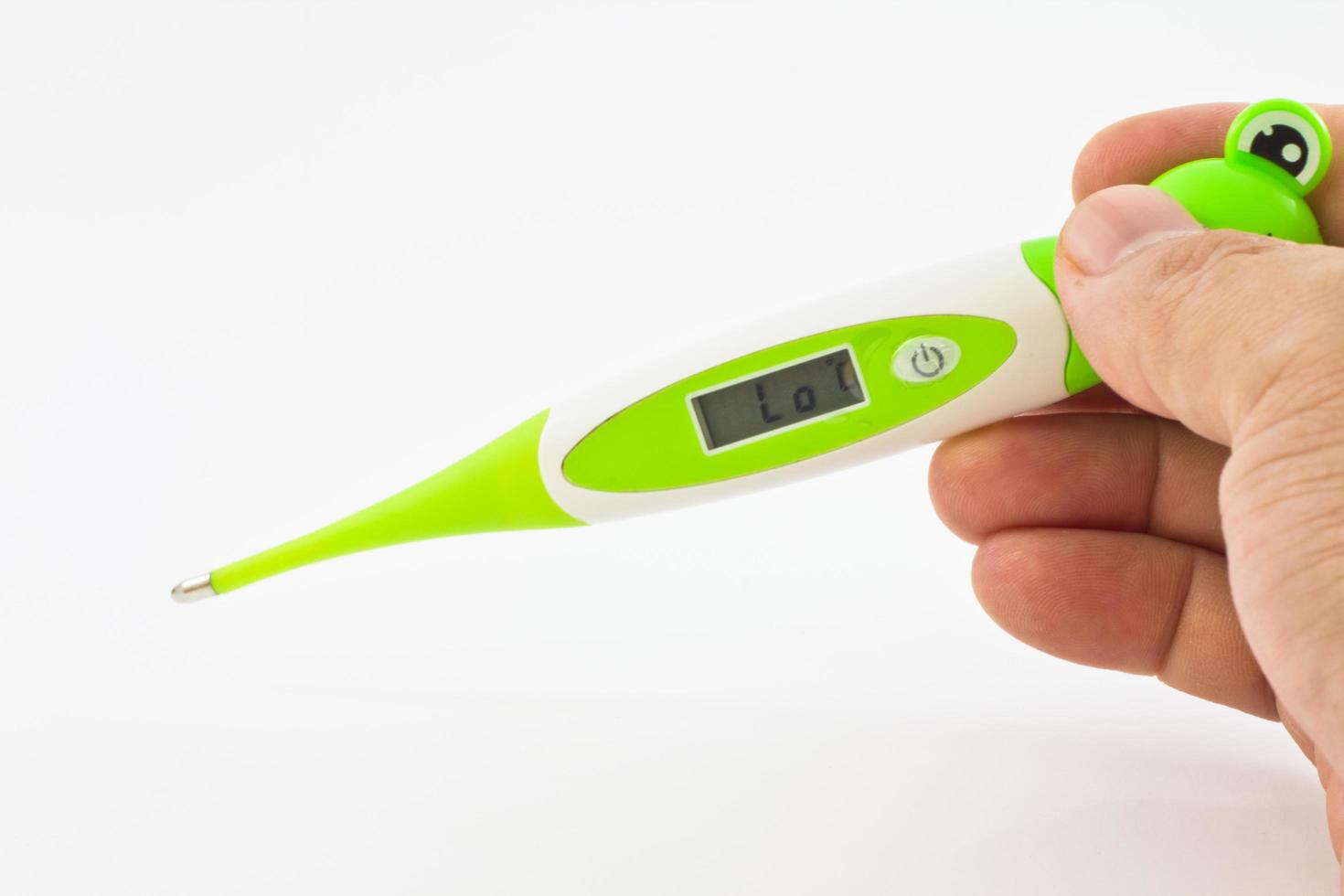 electronic thermometer in hand on a white photo