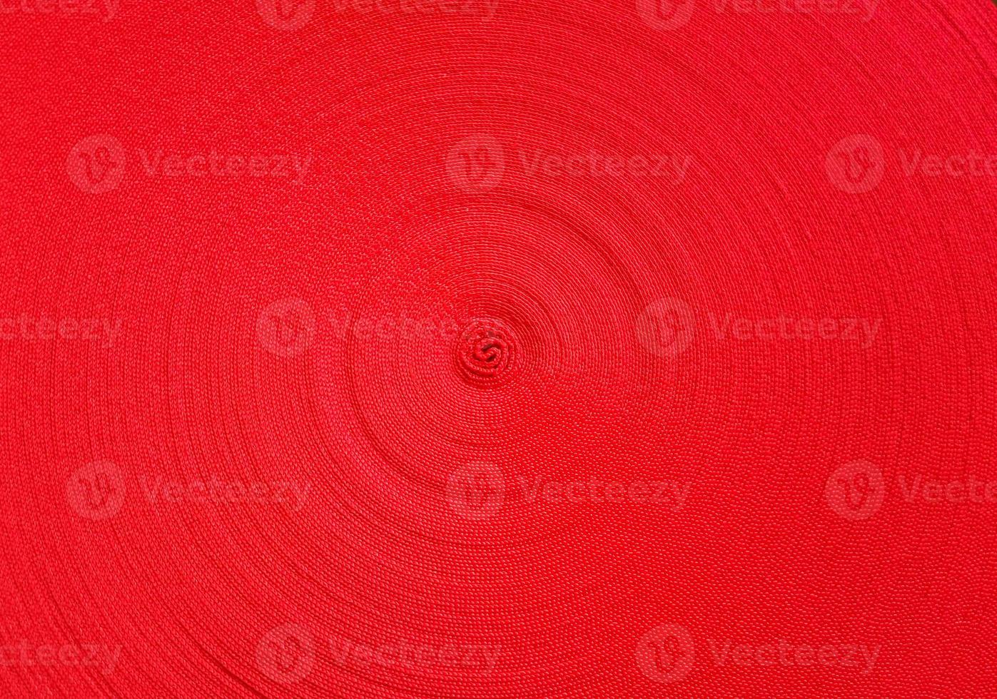 Red abstract circular pattern made of red sling photo