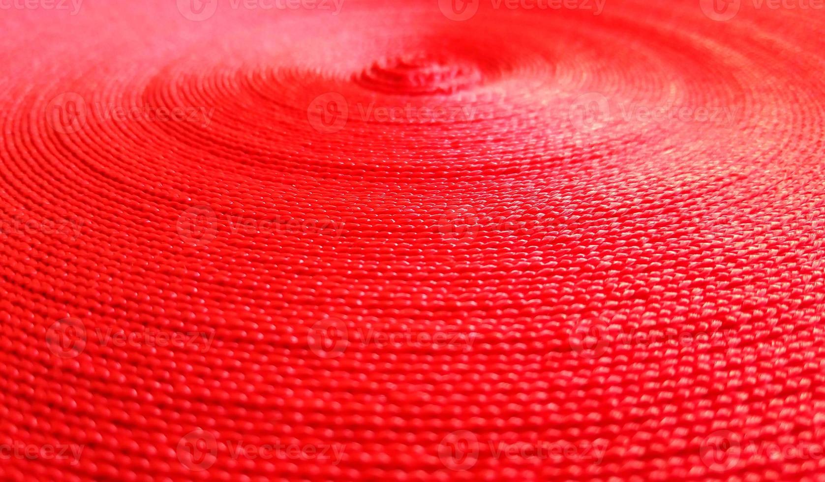 Red abstract circular pattern made of red sling. photo