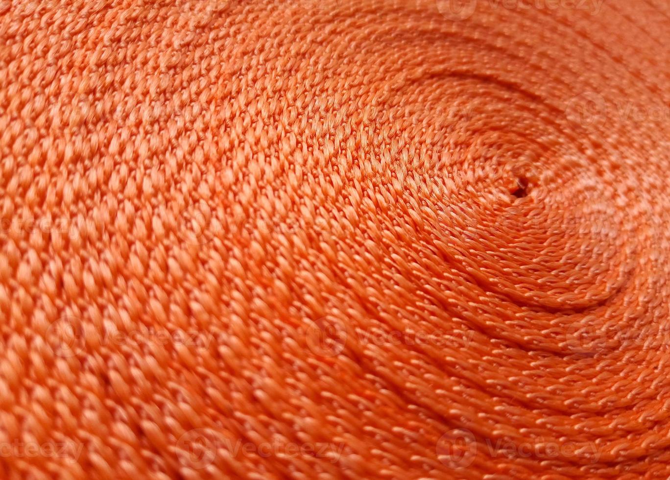 Orange abstract background. Circular pattern of orange sling photo