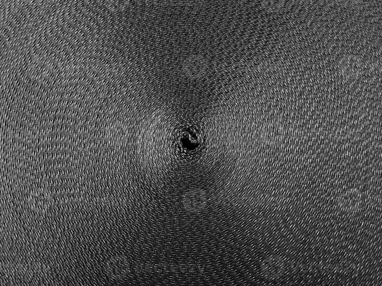 Black abstract circular pattern made of black sling photo