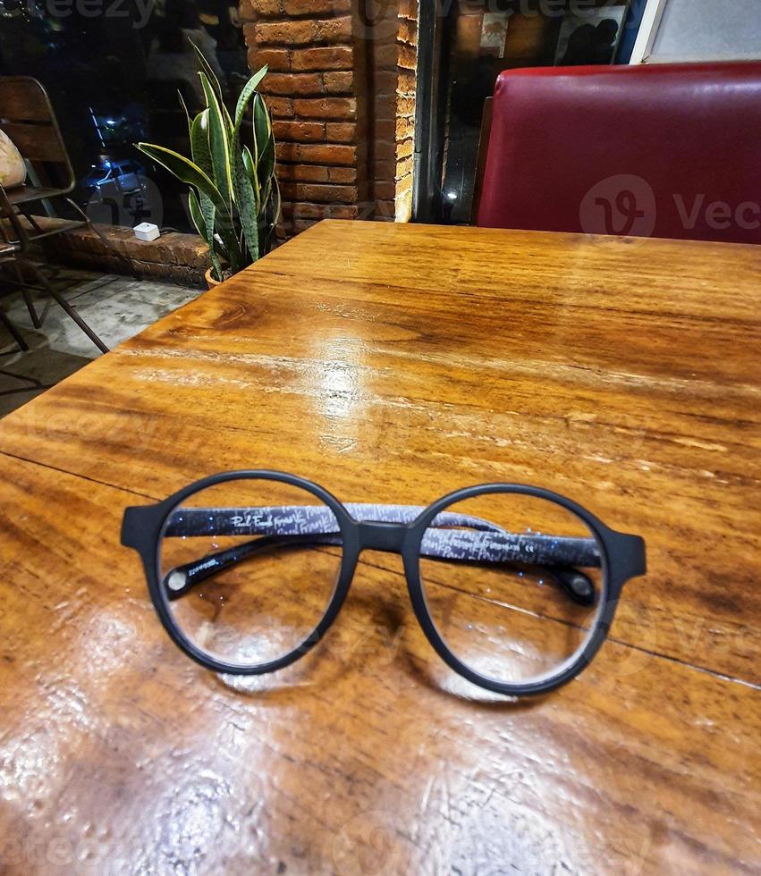 Glasses on a wooden table. photo