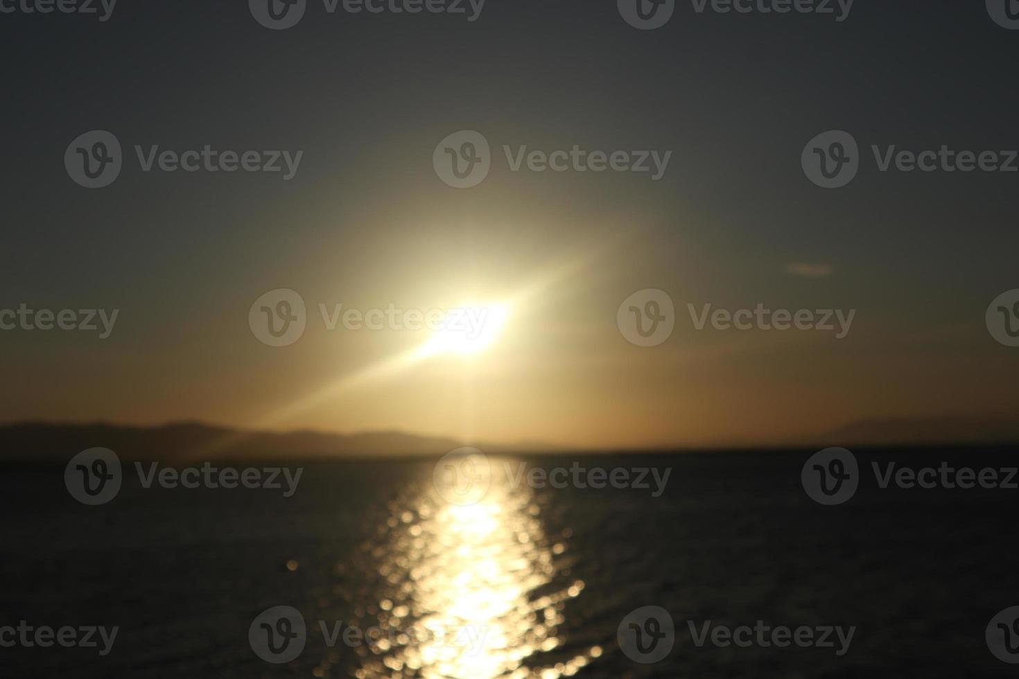 colorful dramatic sky with clouds at sunset. Sunset in  the lake photo