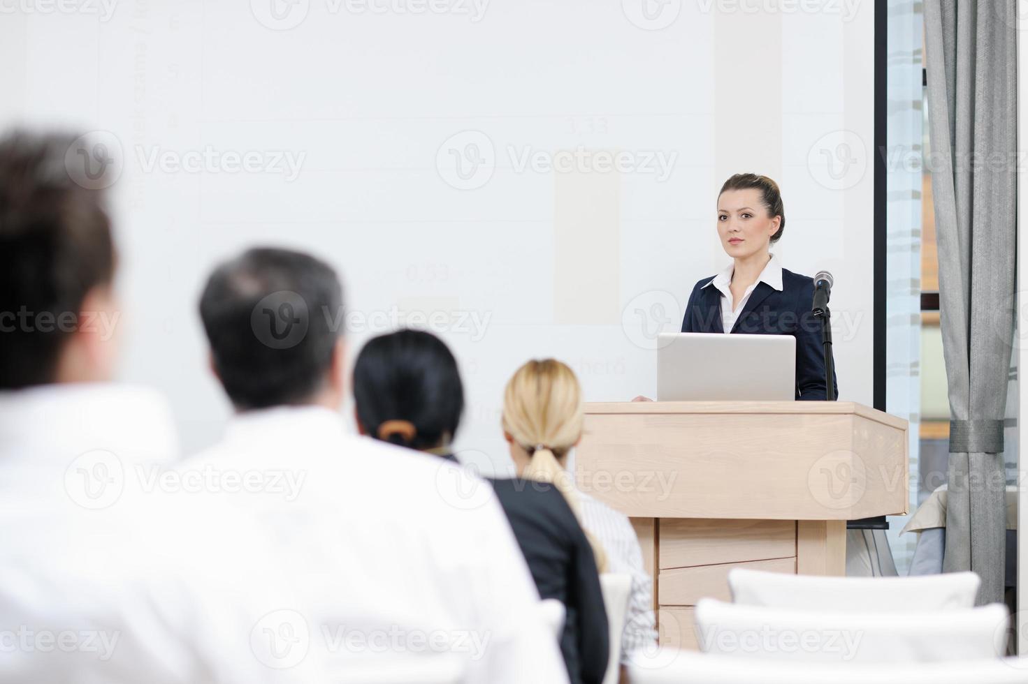 business woman giving presentation photo