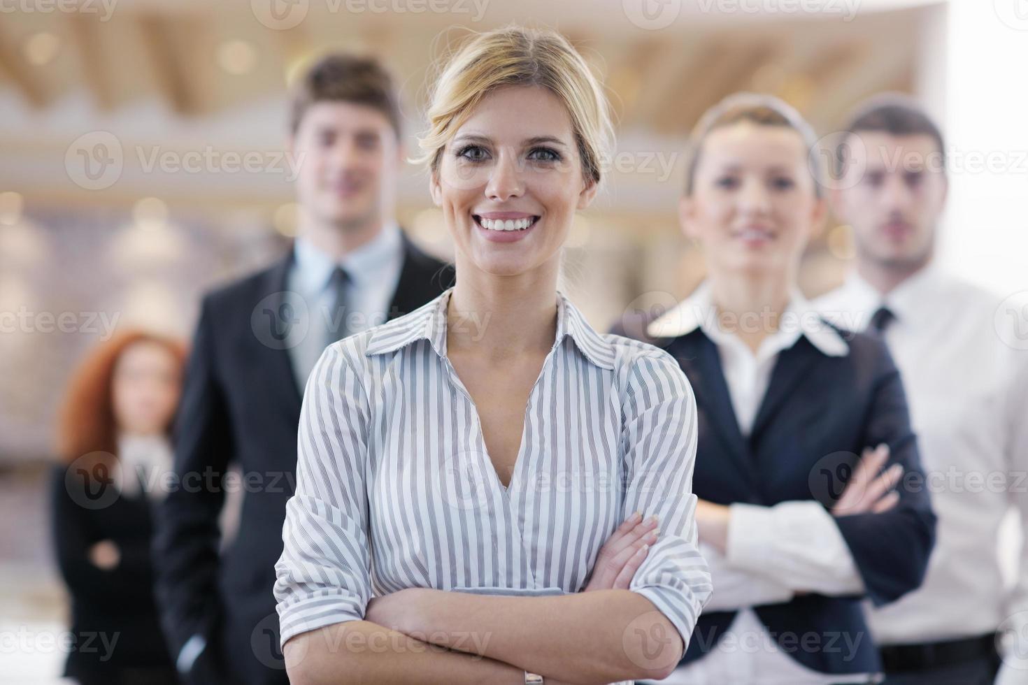 business woman standing with her staff at conference photo