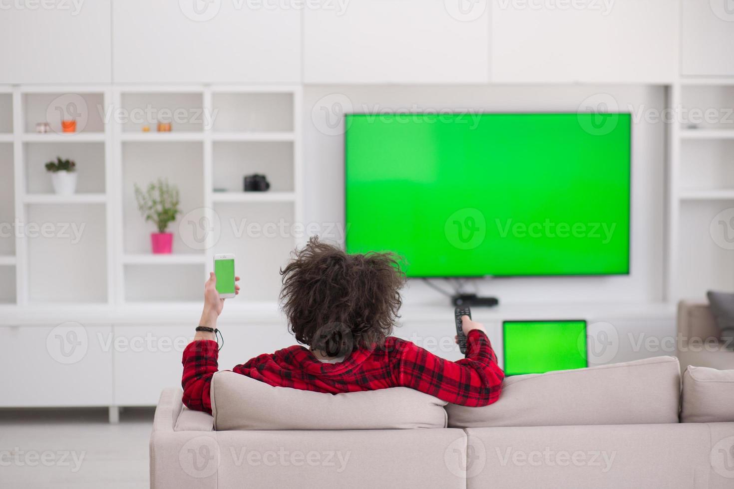 young man in bathrobe enjoying free time photo