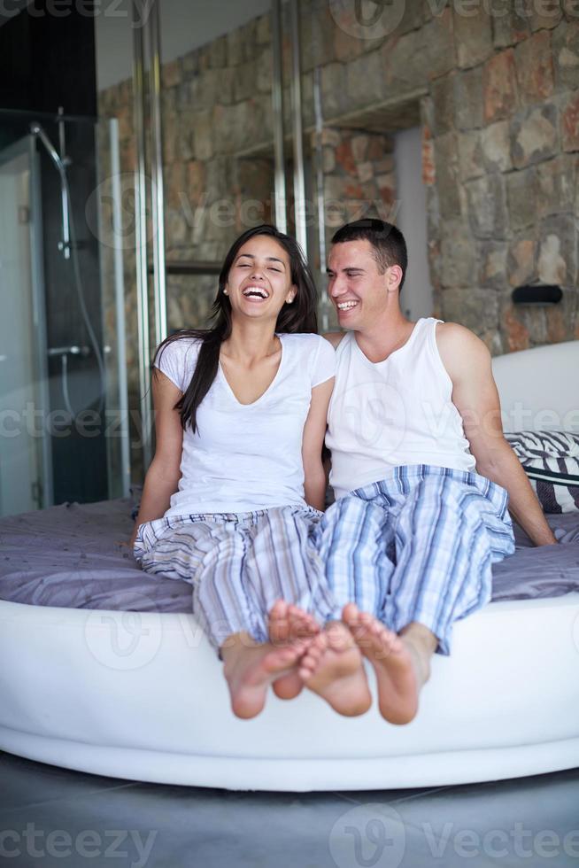 couple relax and have fun in bed photo