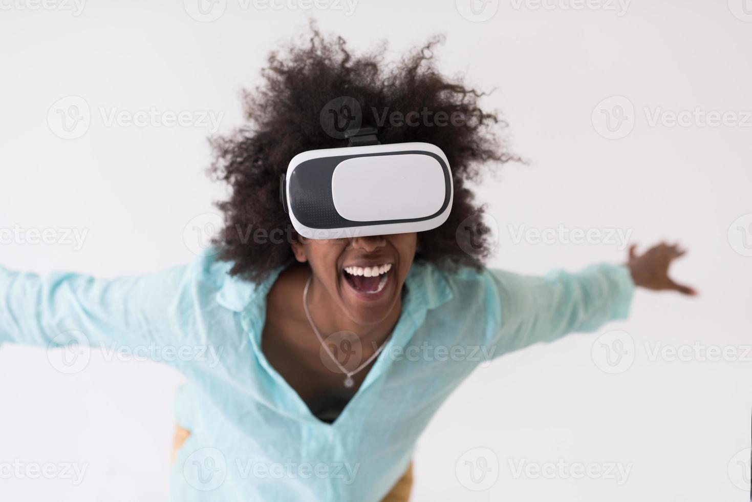 black girl using VR headset glasses of virtual reality photo