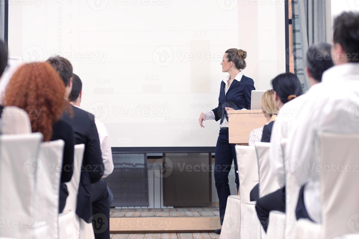 business woman giving presentation photo