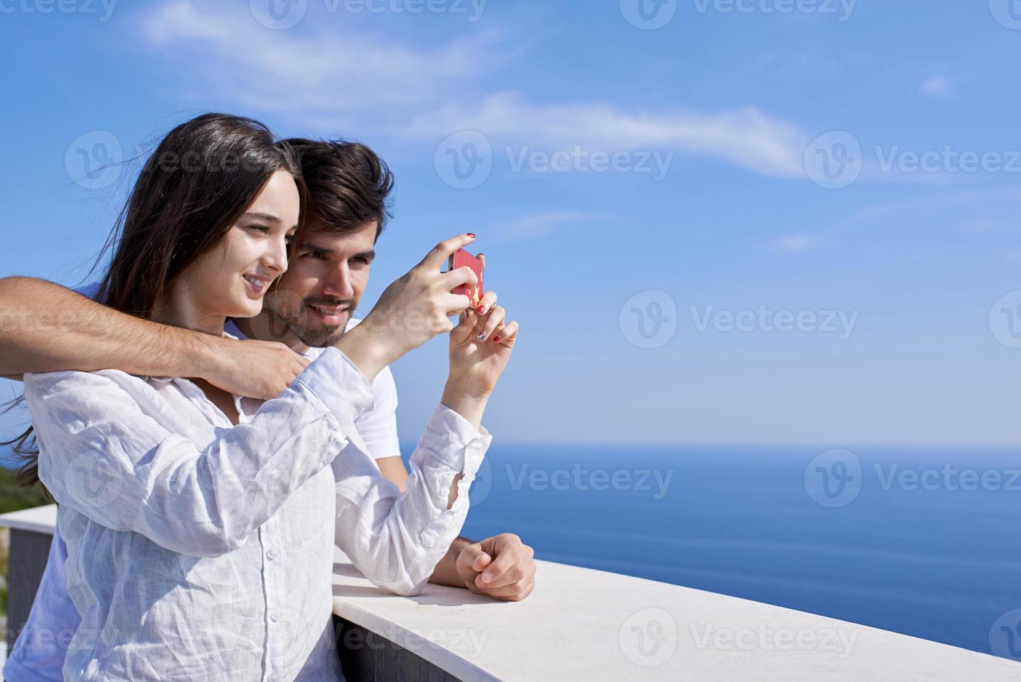 young couple taking selfie with phone photo