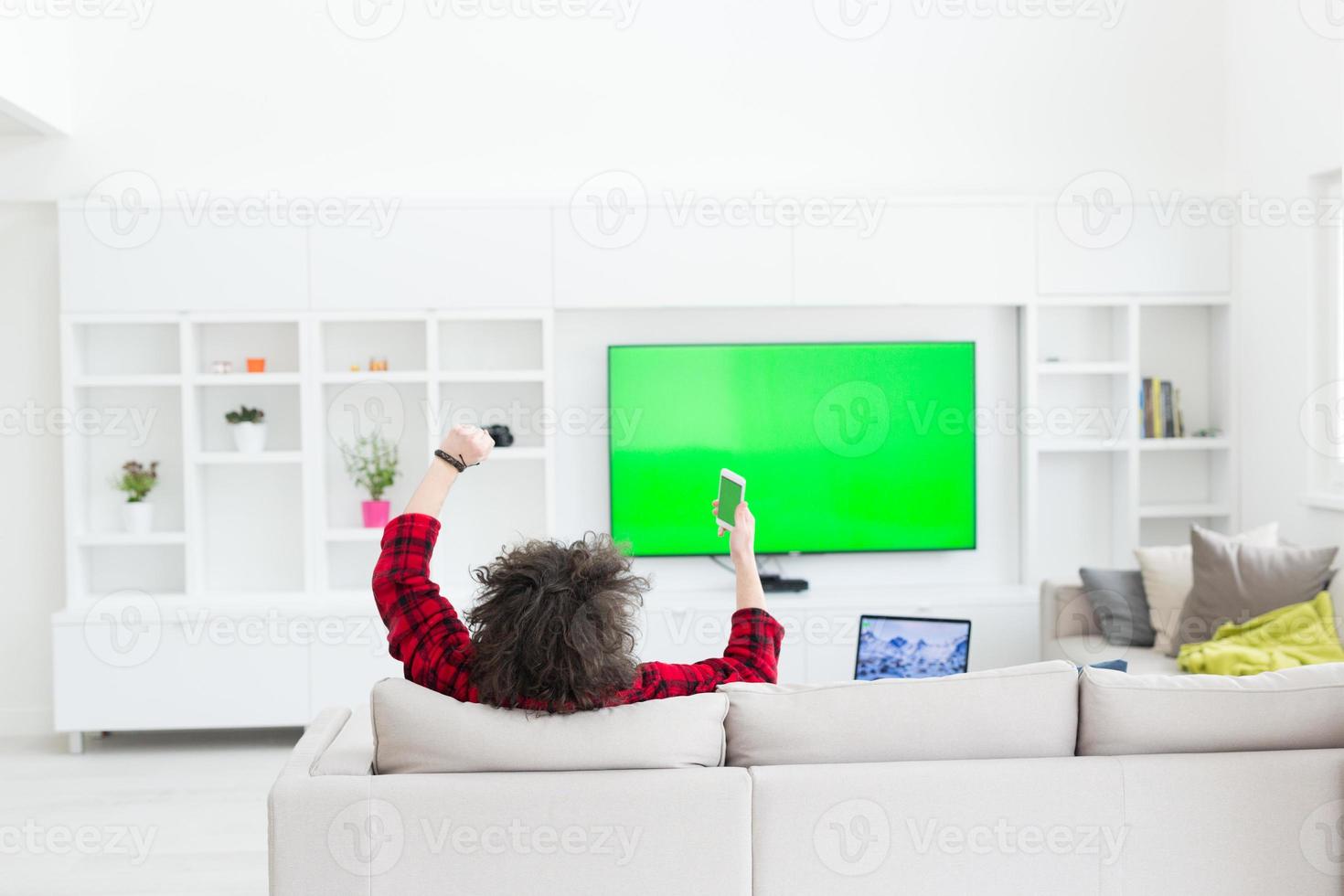 young man in bathrobe enjoying free time photo