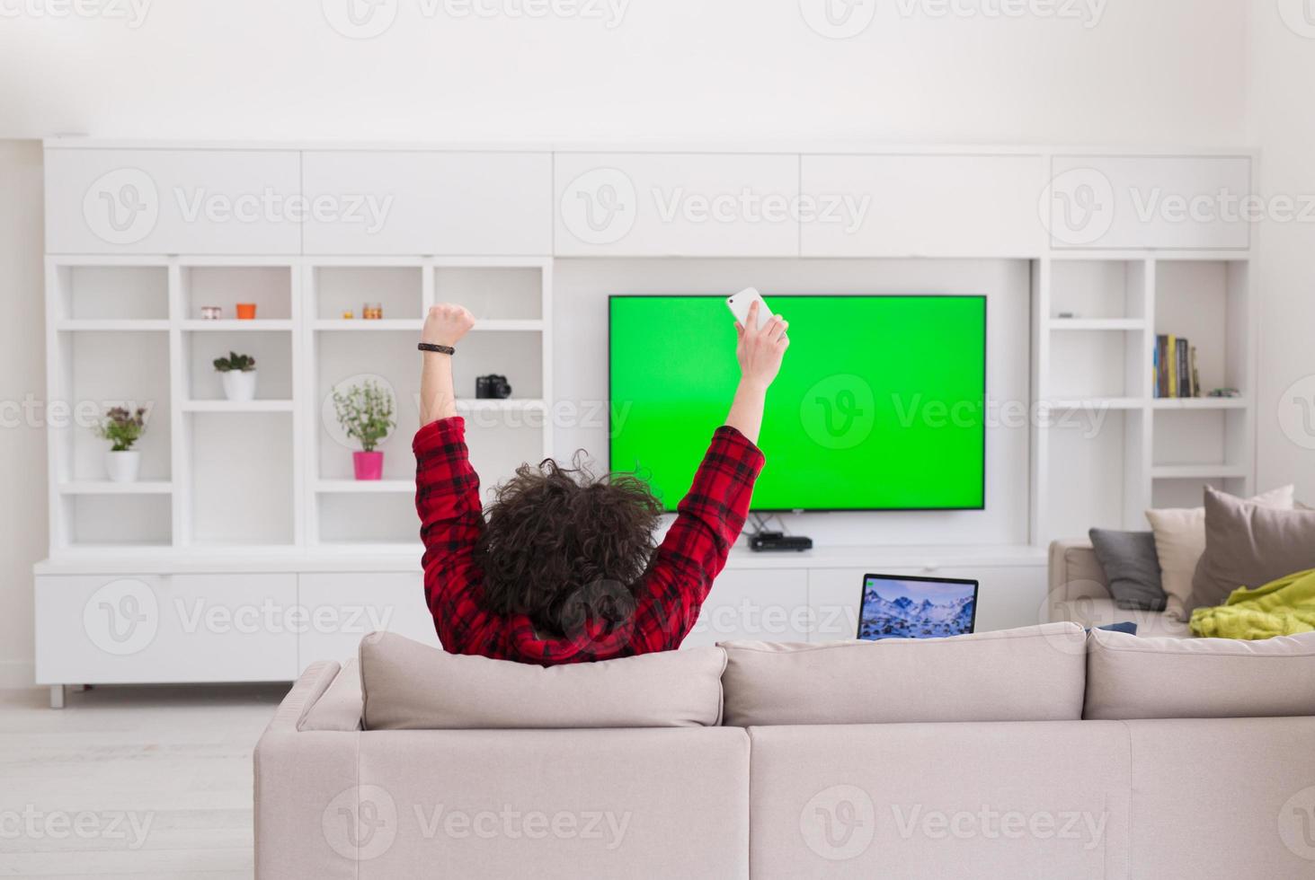 young man in bathrobe enjoying free time photo