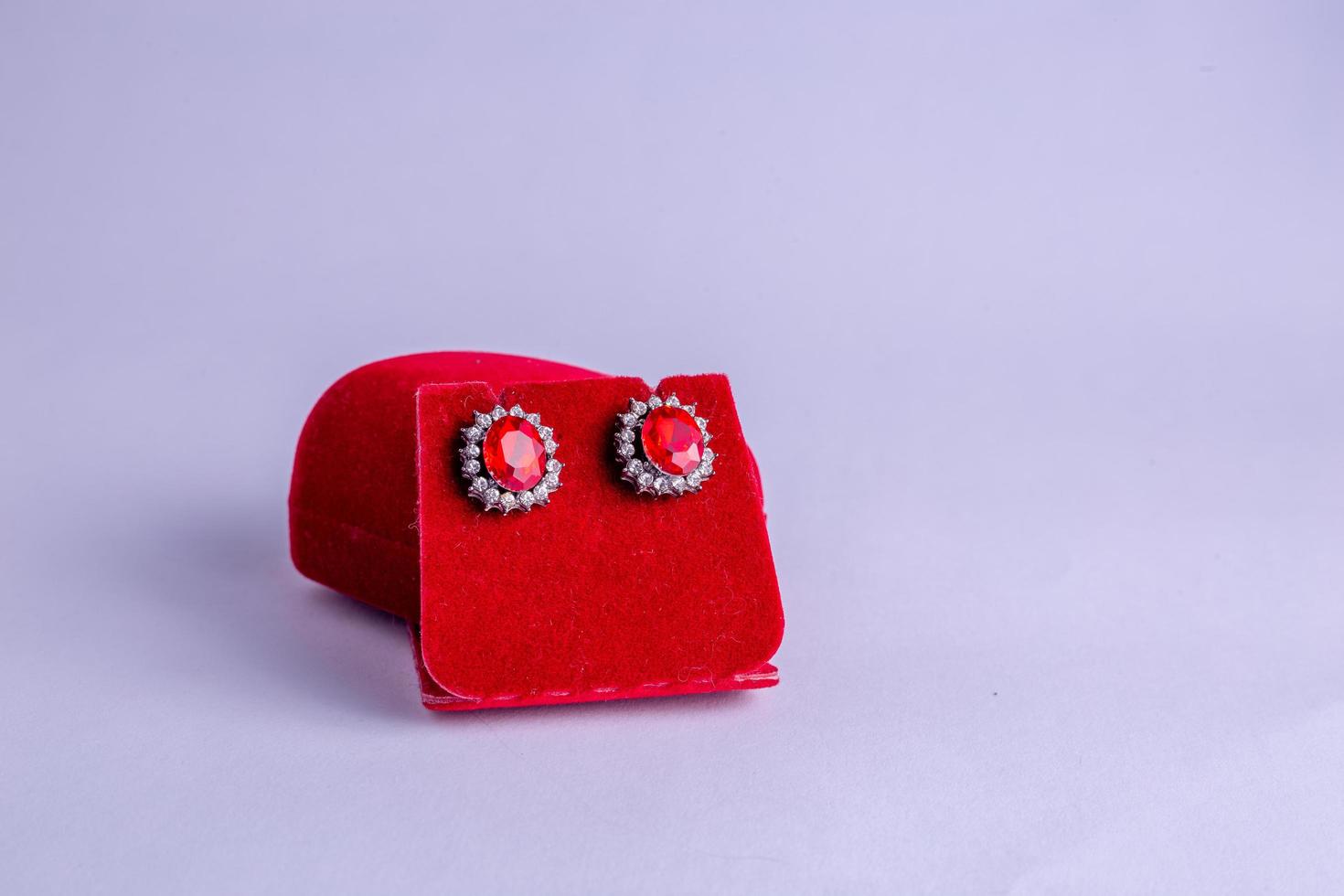 a pair of rings on a red background photo