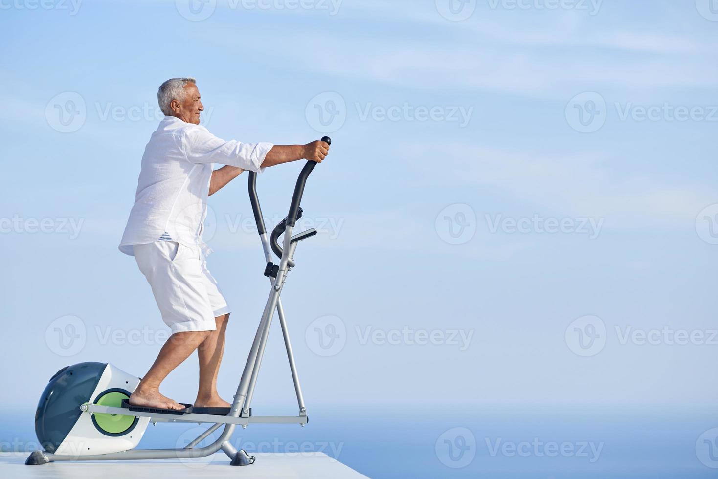 healthy senior man working out photo