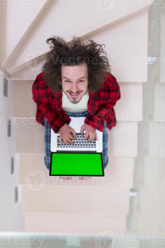 freelancer in bathrobe working from home photo