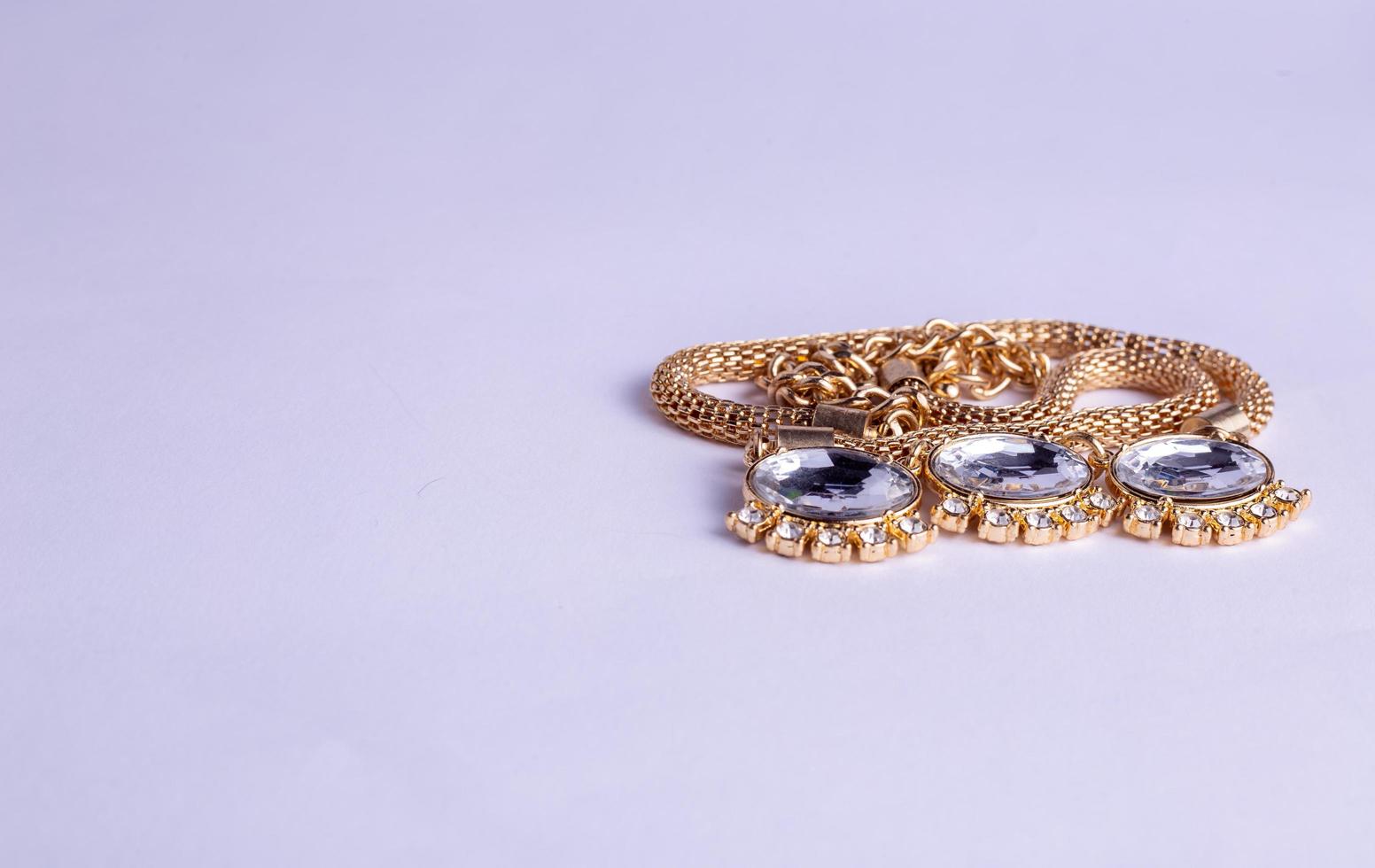 gold necklace on a white photo