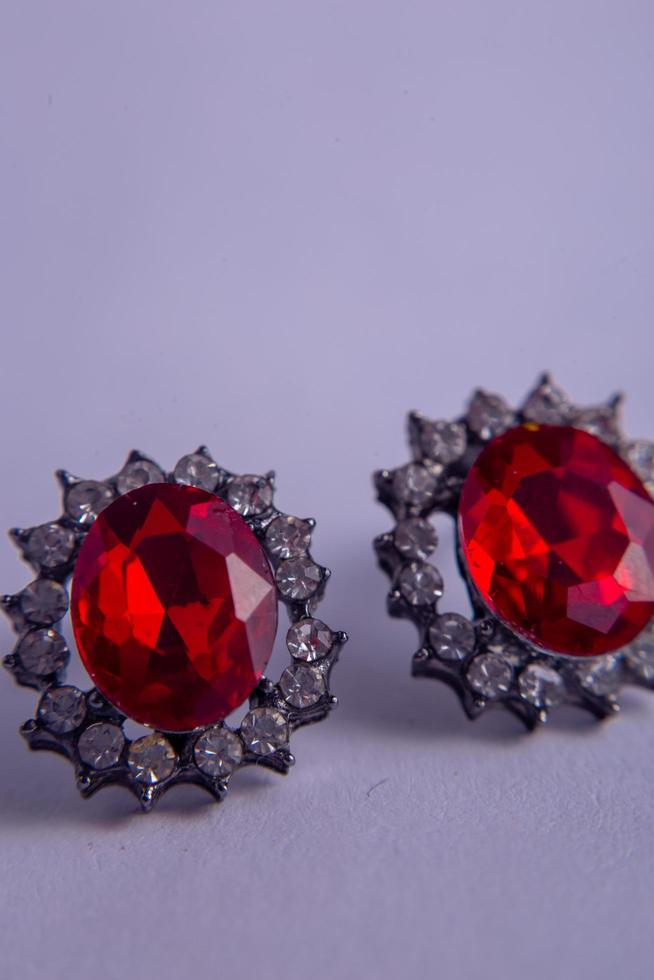 a pair of rings on a red background photo