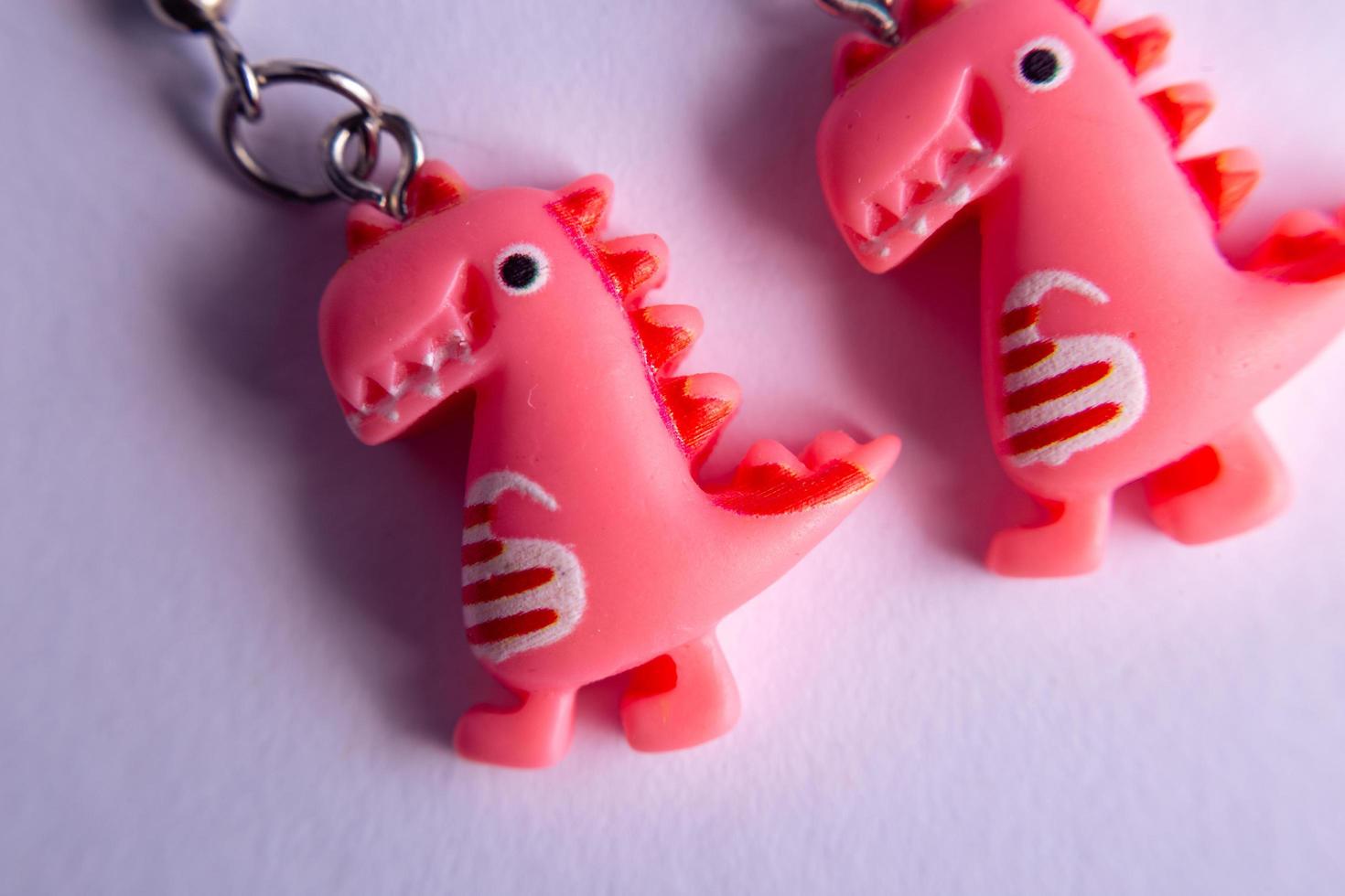 pink dinosaur earrings photo