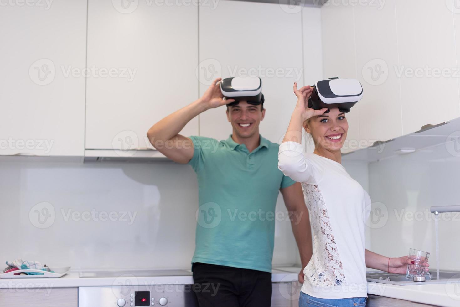 young couple using VR-headset glasses of virtual reality photo