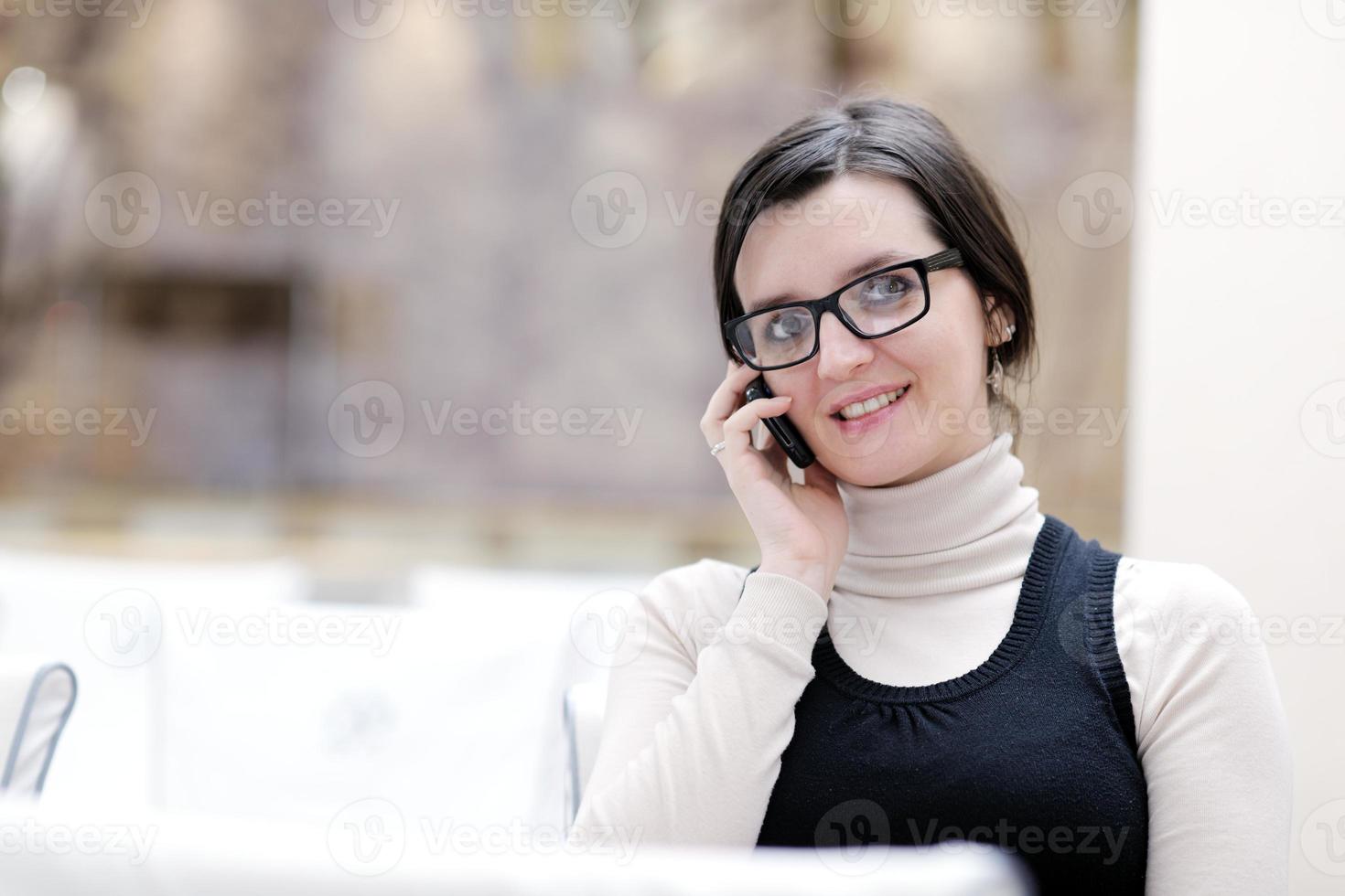 young woman  talking on a phone photo