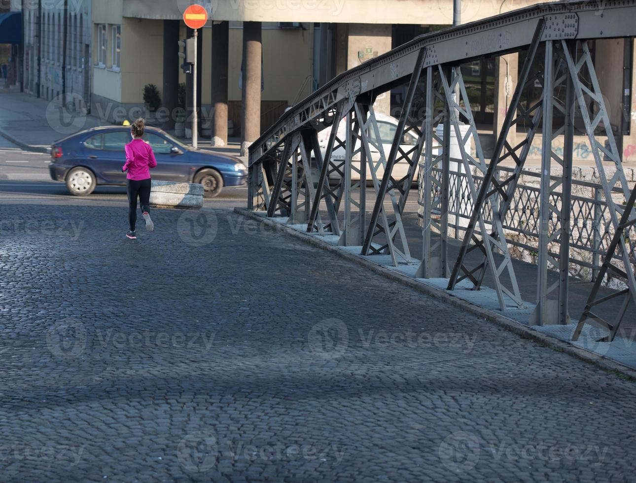 sporty woman jogging on morning photo