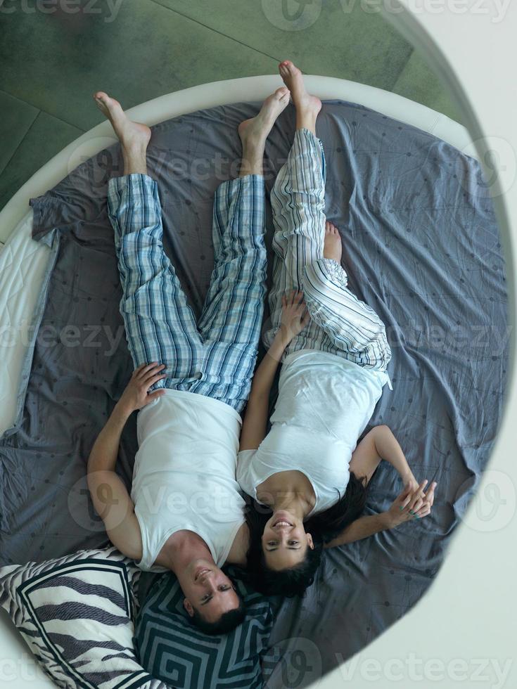 couple relax and have fun in bed photo