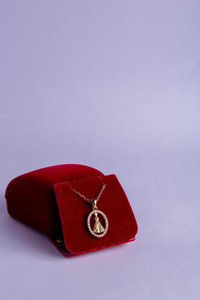 gold necklace on a white photo
