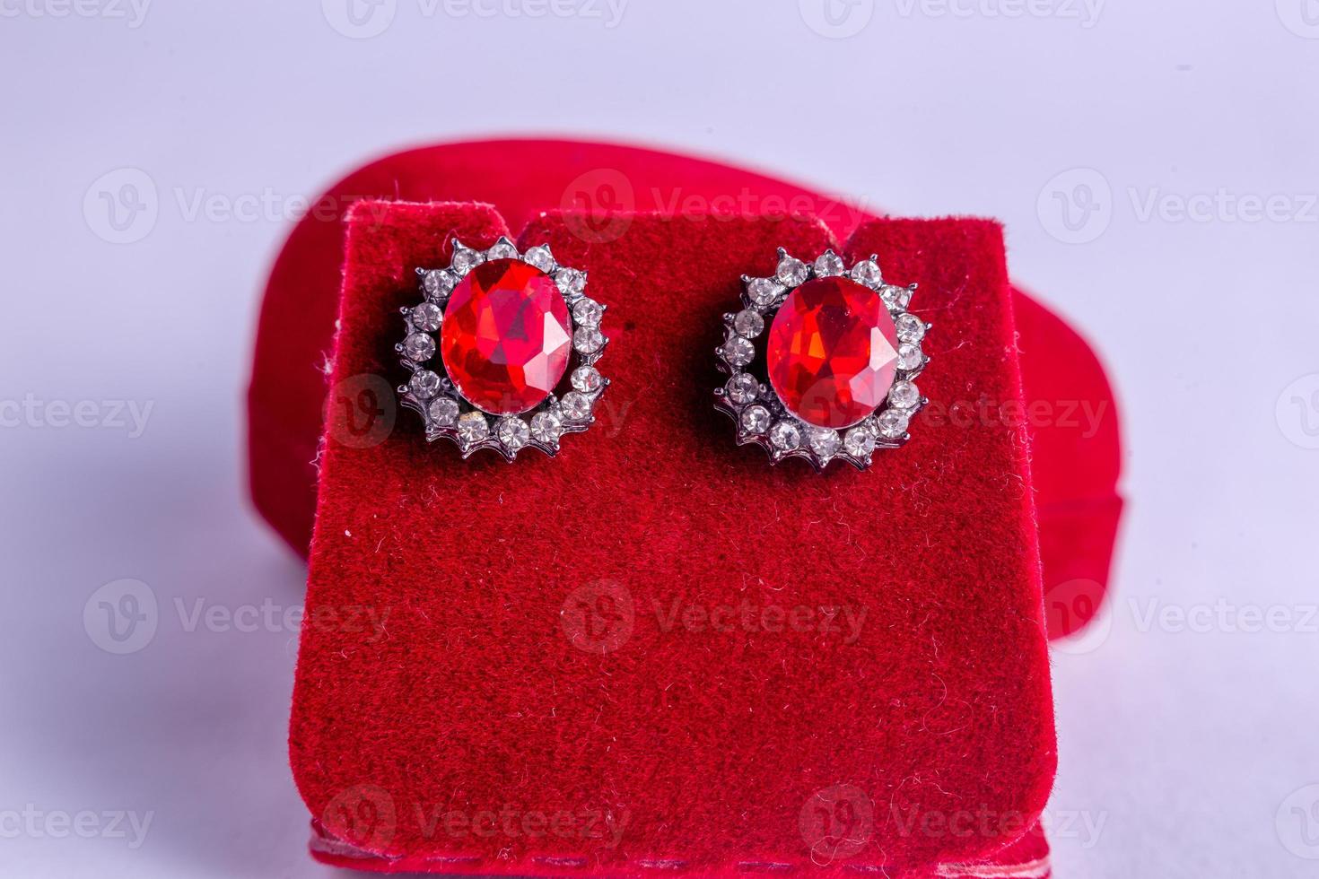 a pair of rings on a red background photo