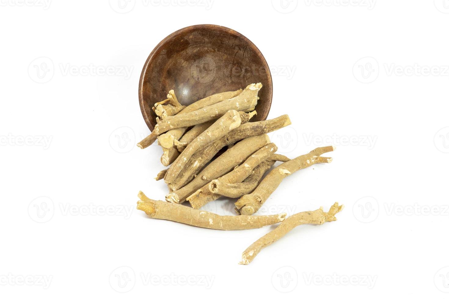 Ashwagandha or Aswaganda OR Indian Ginseng is an Ayurveda medicine Isolated on plain background photo