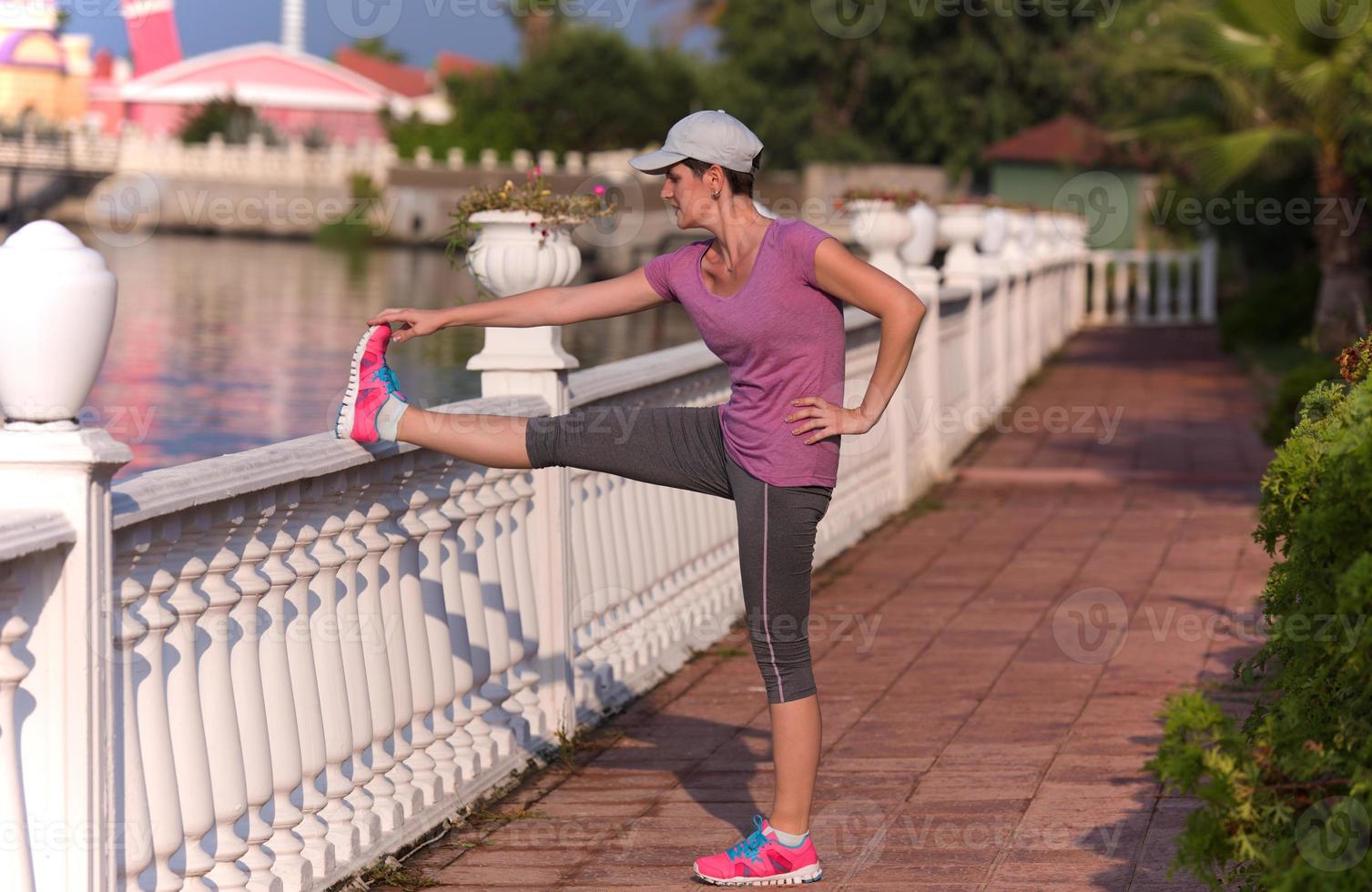 woman  stretching before morning jogging photo