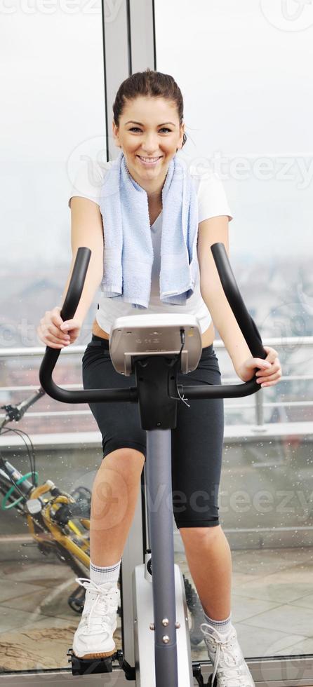 woman workout  in fitness club on running track photo