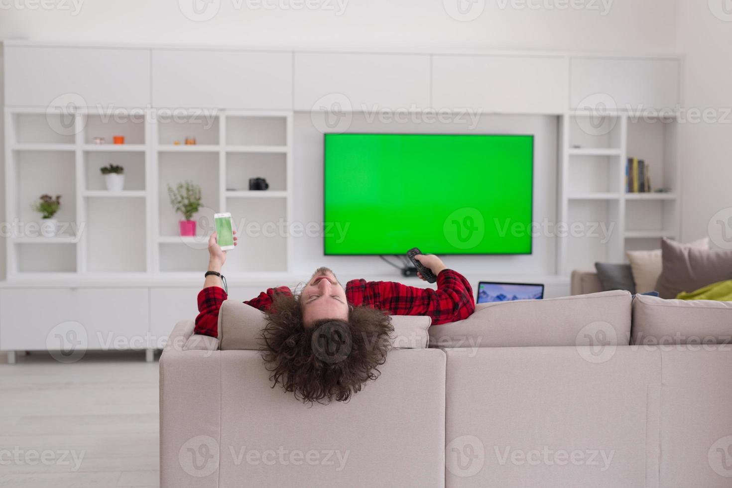 young man in bathrobe enjoying free time photo