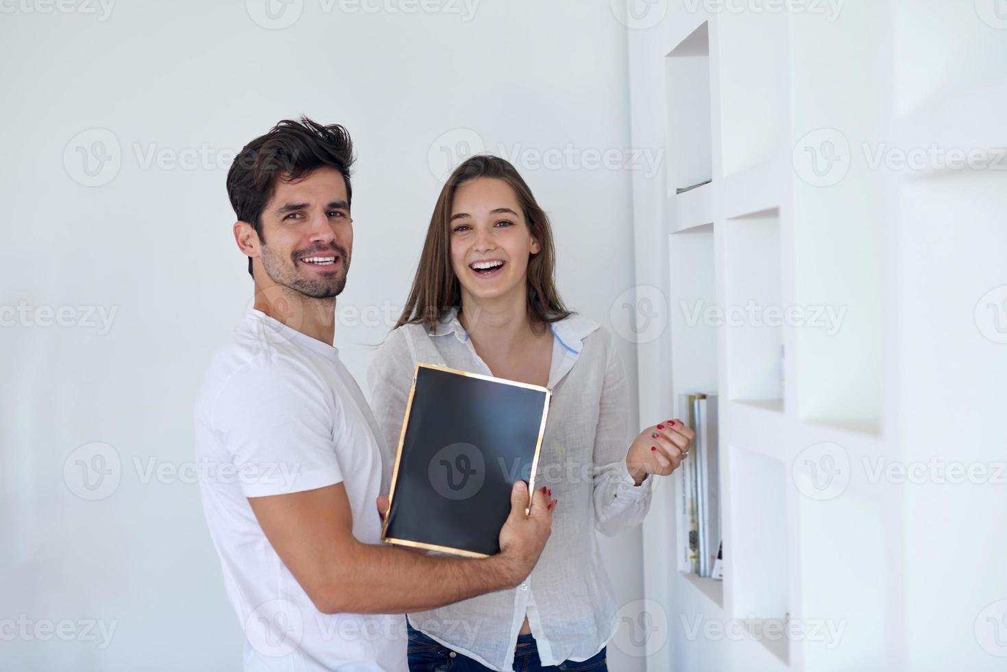 relaxed young couple at home staircase photo