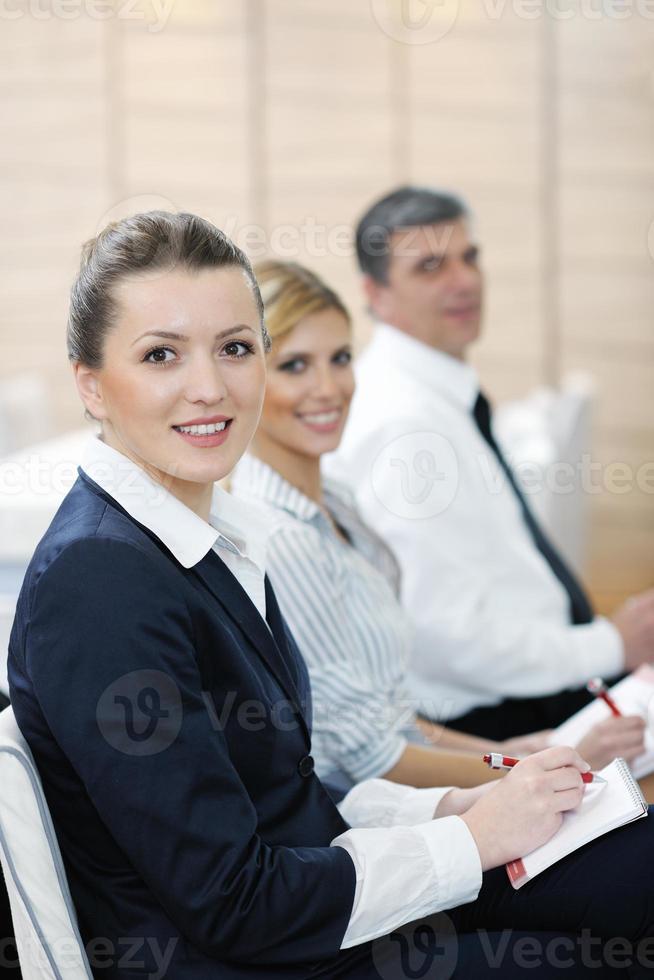 business woman standing with her staff at conference photo