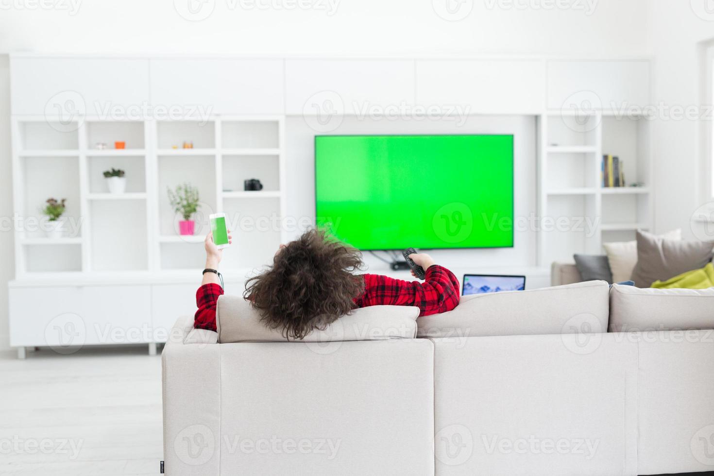 young man in bathrobe enjoying free time photo