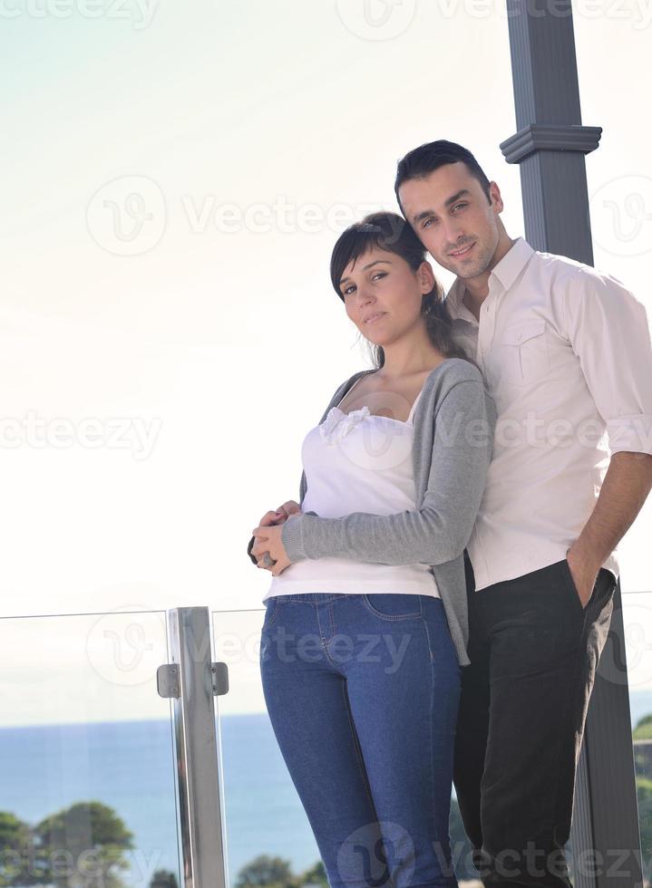 couple relaxing on balcony photo