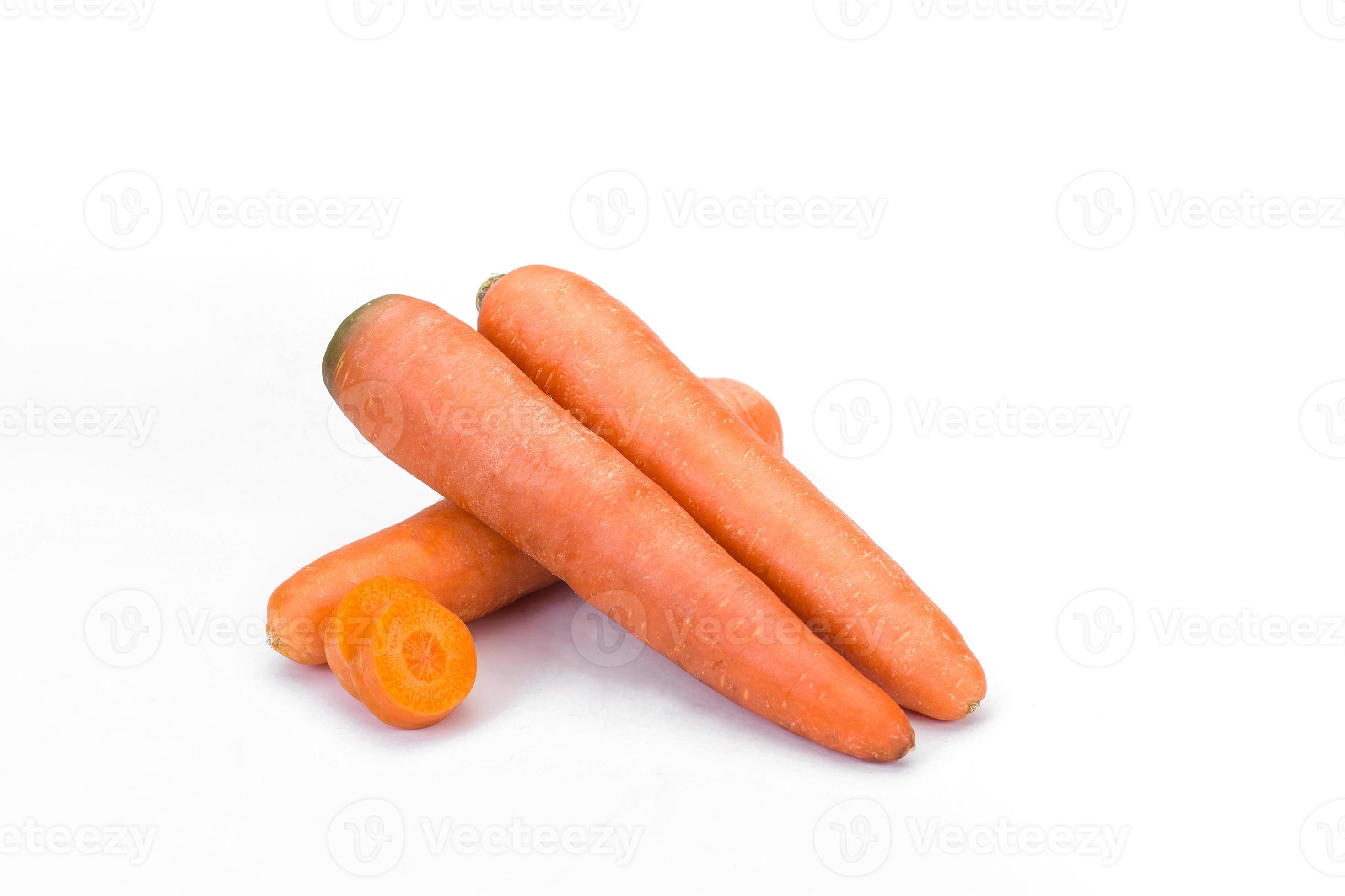 Whole carrots and round pieces isolated on white background.The carrot is a root vegetable