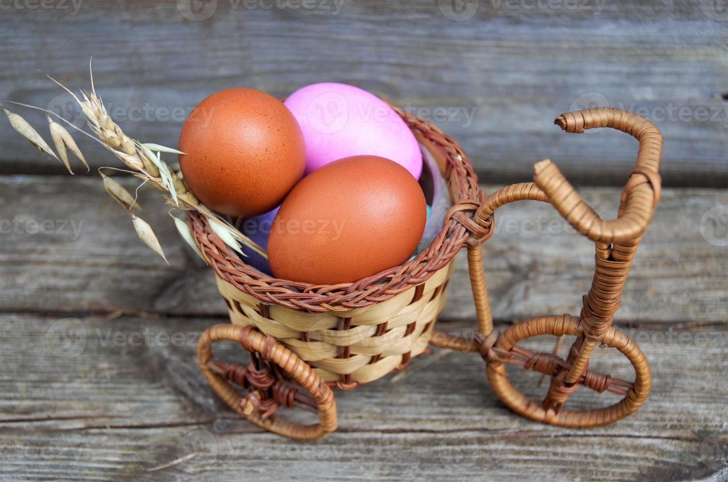 chicken eggs in a wicker basket, The concept of Easter photo