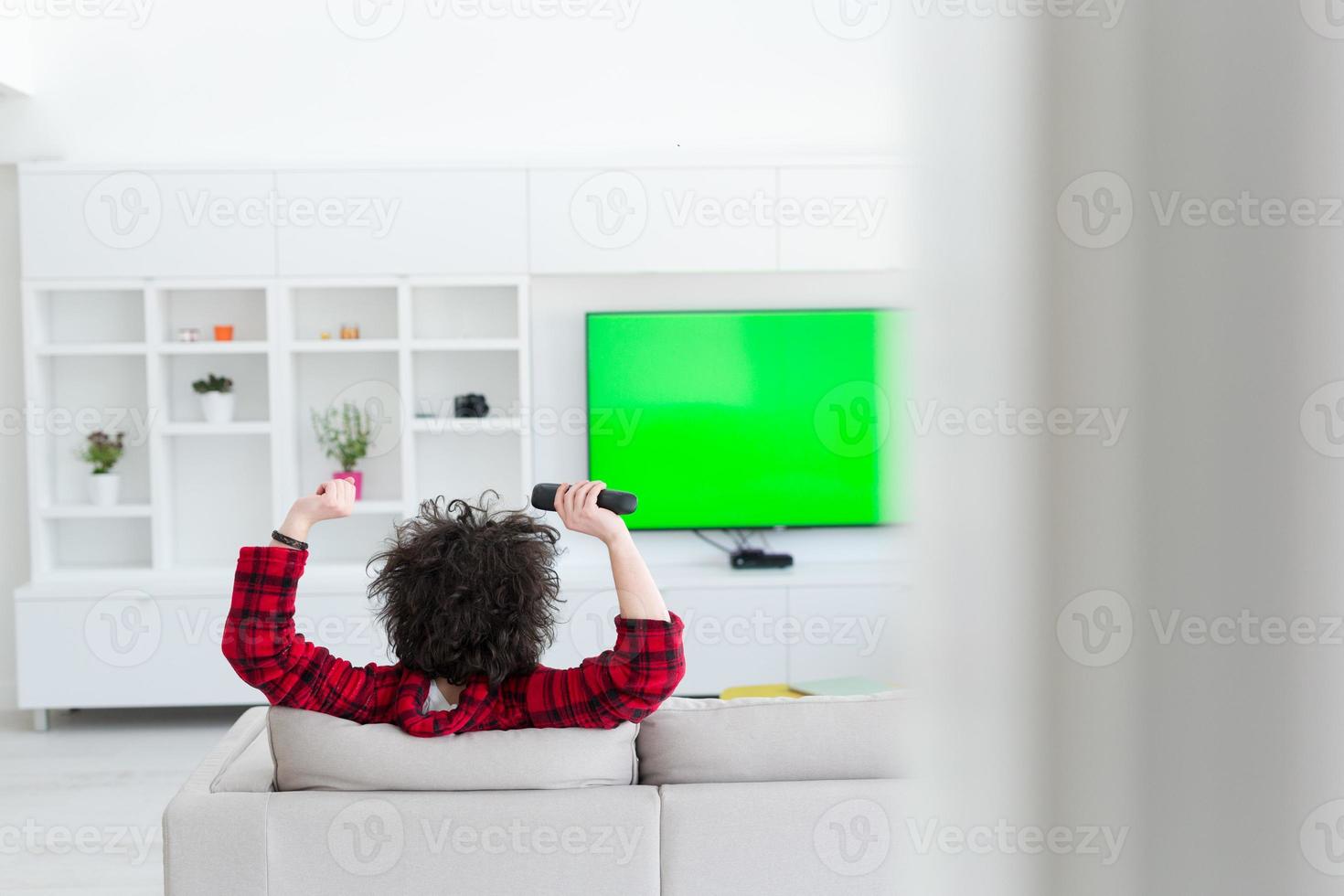 young man in bathrobe enjoying free time photo