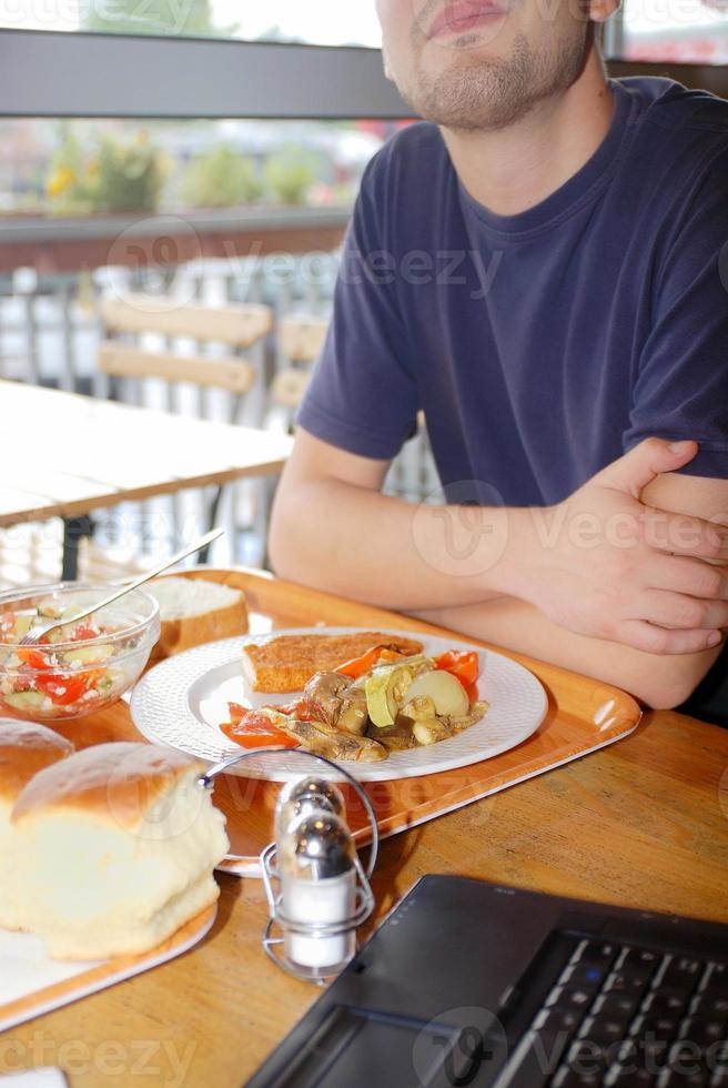man eating healthy food it an restaurant photo