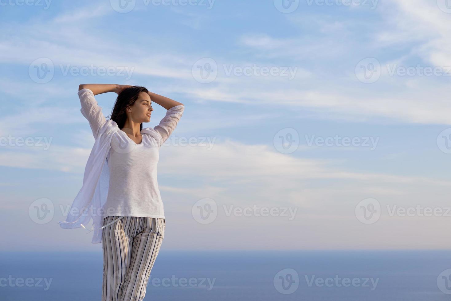 young woman enjoy sunset photo