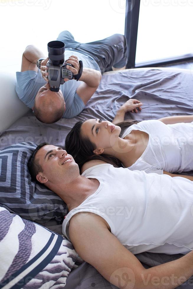 couple relax and have fun in bed photo