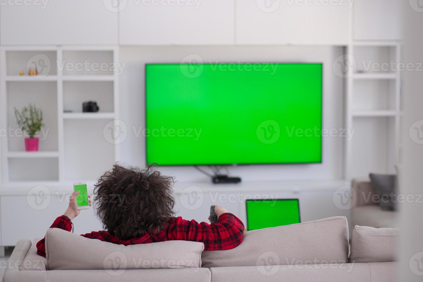 young man in bathrobe enjoying free time photo