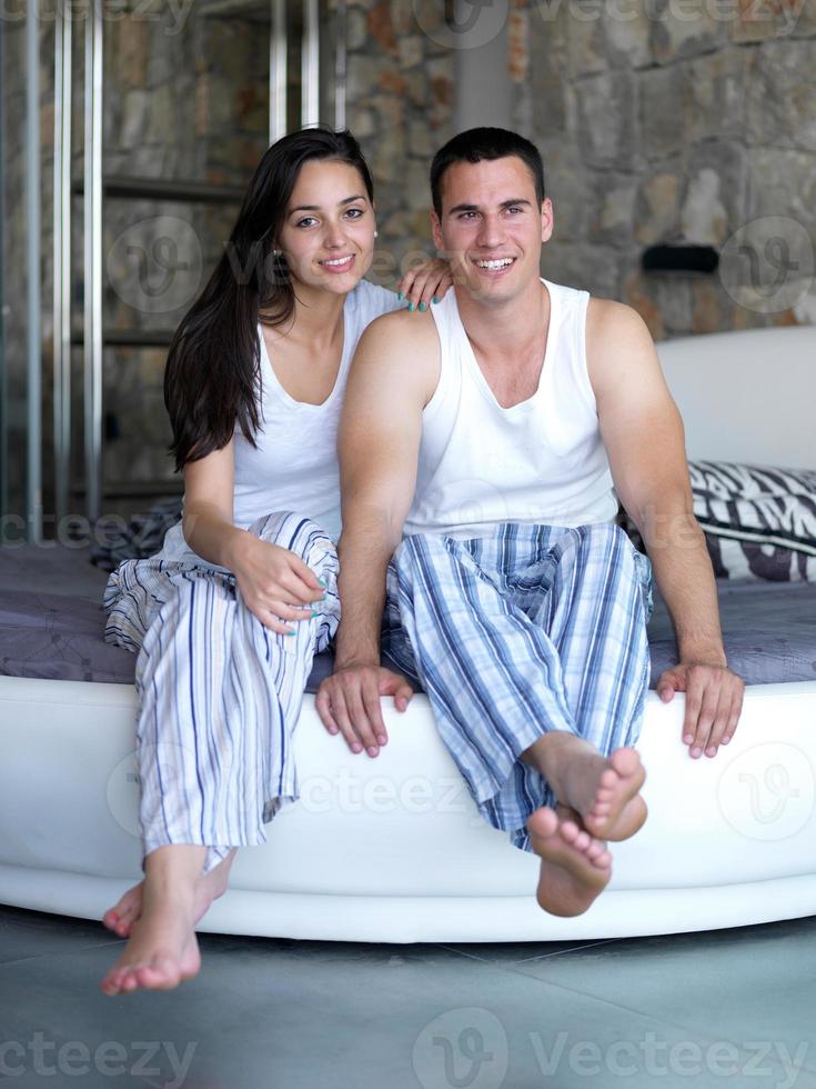 couple relax and have fun in bed photo