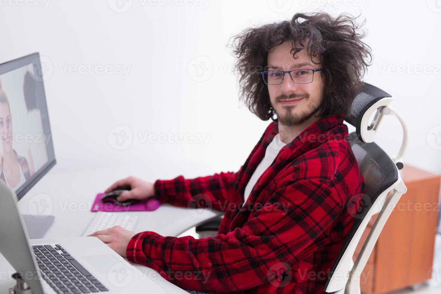 graphic designer in bathrobe working at home photo